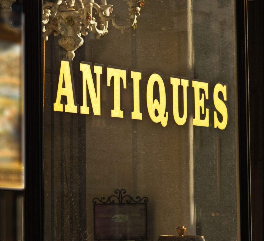 Photo of antiques store window sign.