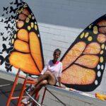 Pinkie Mistry in front of Butterfly Mural in Downtown Sevierville.